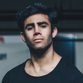 Picture of a cool looking guy in a black t-shirt.